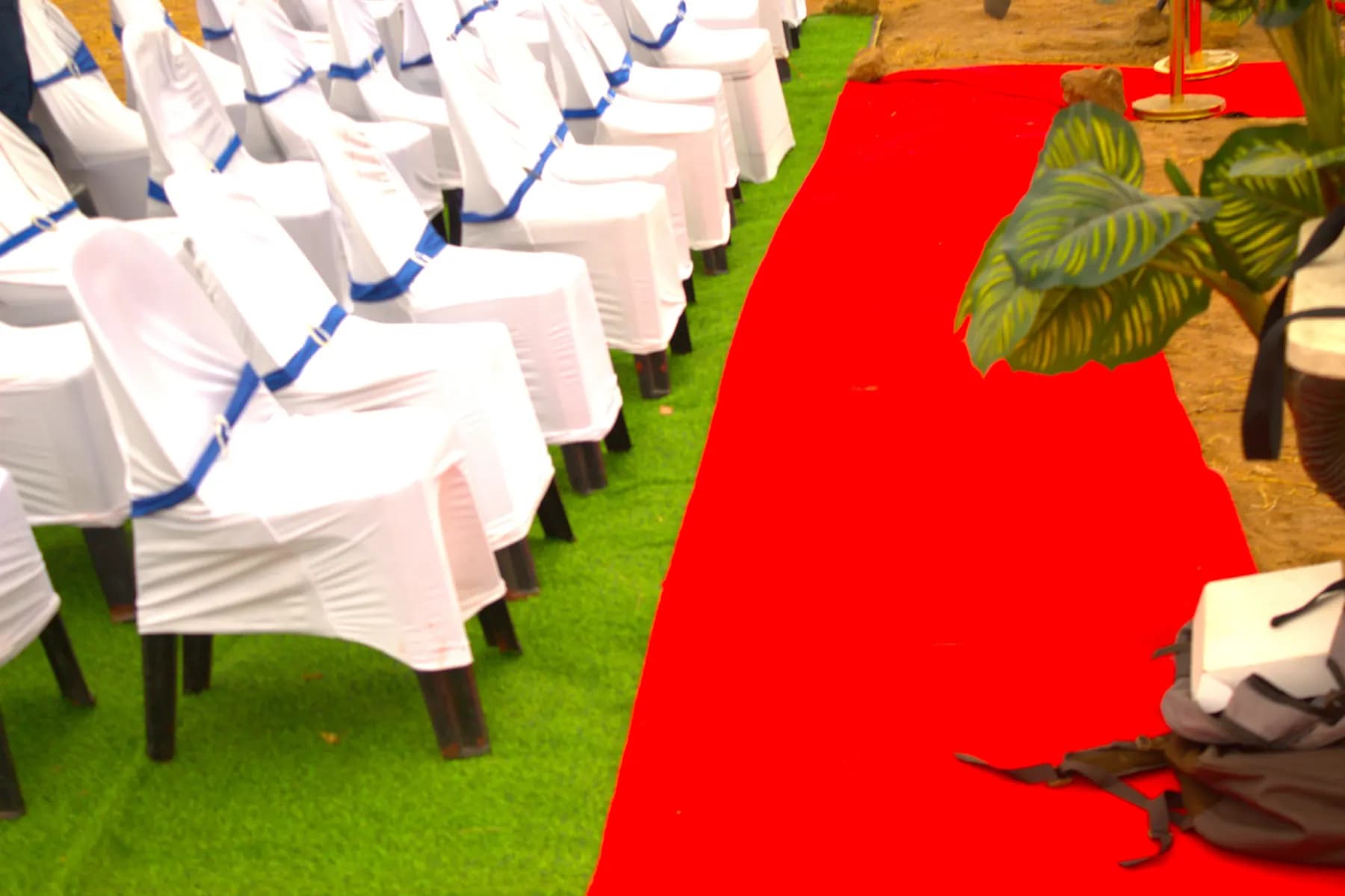 Covered chairs and a red carpet for the service